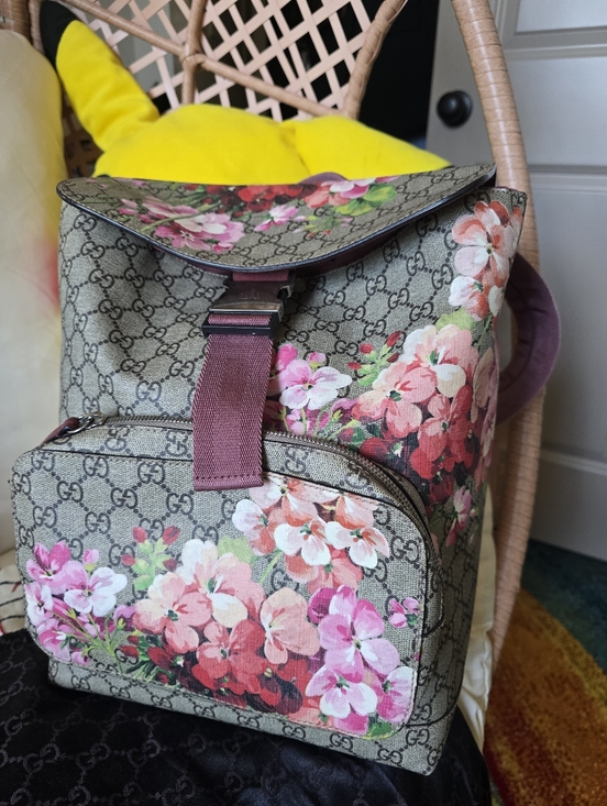Gucci Handbags - Authentic Gucci Brown GG Supreme Floral Canvas Backpack with Pink Interior